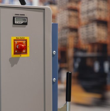 Can you tell me what the red baler button does?